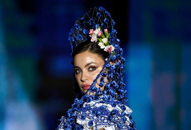 A model presents a creation by Agus Dorado during the International Flamenco Fashion Week - SIMOF in Seville on January 31, 2026. (Photo by CRISTINA QUICLER / AFP)