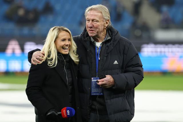 German football manager Horst Hrubesch reacts with tv presenter Julia Simic prior to the German first division Bundesliga football match between Hamburger SV and FC Bayern Munich in Hamburg, northern Germany on January 31, 2026. (Photo by IBRAHIM OT / AFP) / DFL REGULATIONS PROHIBIT ANY USE OF PHOTOGRAPHS AS IMAGE SEQUENCES AND/OR QUASI-VIDEO