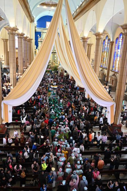 Garifuna Afro-Indigenous people attend mass at the Basilica of Suyapa during celebrations for the 279th anniversary of the Virgin of Suyapa, in Tegucigalpa, on January 31, 2026. Next February 3 marks the anniversary of the Virgin of Suyapa, declared Patroness of Honduras by Pope Pius XII in 1925. (Photo by Orlando SIERRA / AFP)
