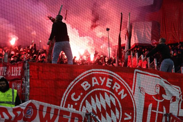 Fans burn flares during the German first division Bundesliga football match between Hamburger SV and FC Bayern Munich in Hamburg, northern Germany on January 31, 2026. (Photo by Ibrahim OT / AFP) / DFL REGULATIONS PROHIBIT ANY USE OF PHOTOGRAPHS AS IMAGE SEQUENCES AND/OR QUASI-VIDEO