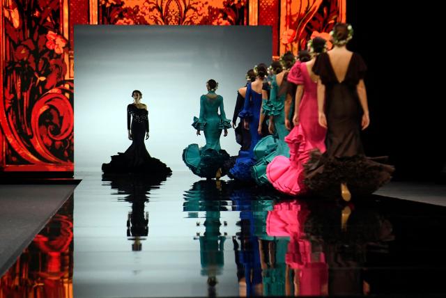 Models present creations by Alejandro Andana during the International Flamenco Fashion Week - SIMOF in Seville on January 31, 2026. (Photo by Cristina Quicler / AFP)