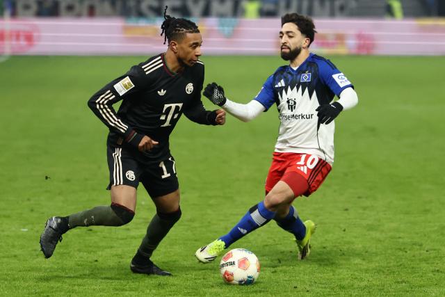 Hamburg's Portuguese midfielder #20 Fabio Vieira (R) and Bayern Munich's French midfielder #17 Michael Olise vie for the ball during the German first division Bundesliga football match between Hamburger SV and FC Bayern Munich in Hamburg, northern Germany on January 31, 2026. (Photo by IBRAHIM OT / AFP) / DFL REGULATIONS PROHIBIT ANY USE OF PHOTOGRAPHS AS IMAGE SEQUENCES AND/OR QUASI-VIDEO
