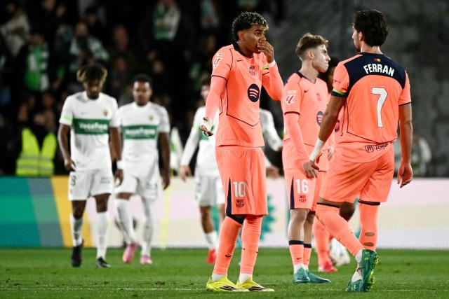 Barcelona's Spanish forward #10 Lamine Yamal (3R) reacts to Elche's goal scored by Elche's Uruguayan forward #20 Alvaro Rodriguez during the Spanish league football match between Elche CF and FC Barcelona at thge Martinez Valero stadium in Elche on January 31, 2026. (Photo by JOSE JORDAN / AFP)