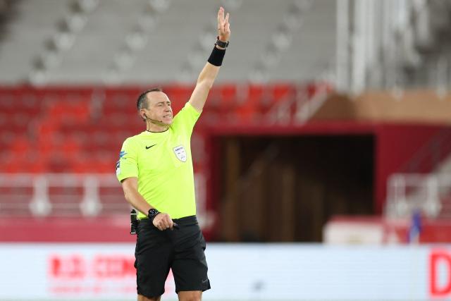 French referee Ruddy Buquet gestures during the French L1 football match between AS Monaco and Stade Rennais FC at the Louis II Stadium (Stade Louis II) in the Principality of Monaco on January 31, 2026. (Photo by Valery HACHE / AFP)
