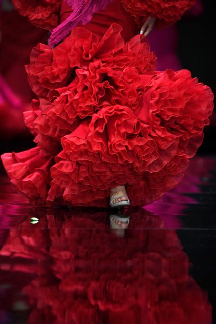 A model presents a creation by Yolanda Rivas during the International Flamenco Fashion Week - SIMOF in Seville on January 31, 2026. (Photo by Cristina Quicler / AFP)