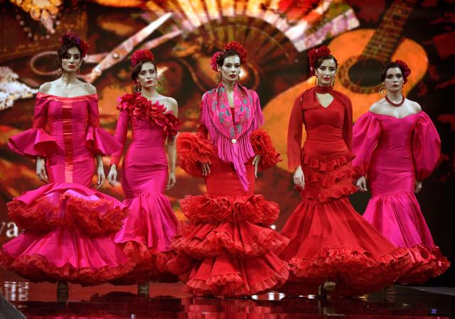 Models present creations by Yolanda Rivas during the International Flamenco Fashion Week - SIMOF in Seville on January 31, 2026. (Photo by Cristina Quicler / AFP)