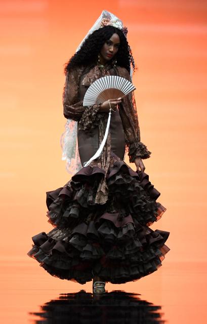 A model presents a creation by Yolanda Rivas during the International Flamenco Fashion Week - SIMOF in Seville on January 31, 2026. (Photo by Cristina Quicler / AFP)