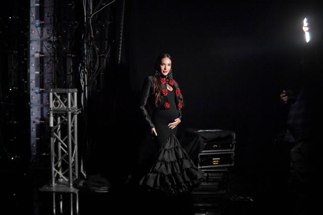 Model Ana Moya poses for photographs backstage ahead of the Rosa Pedroche show during the International Flamenco Fashion Week - SIMOF in Seville on January 31, 2026. (Photo by Cristina Quicler / AFP)