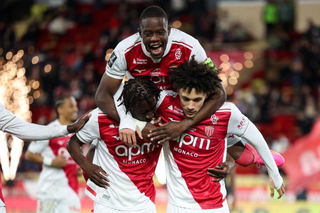 Monaco's French midfielder #11 Maghnes Akliouche (R) celebrates with teammates after scoring his team's second goal during the French L1 football match between AS Monaco and Stade Rennais FC at the Louis II Stadium (Stade Louis II) in the Principality of Monaco on January 31, 2026. (Photo by Valery HACHE / AFP)