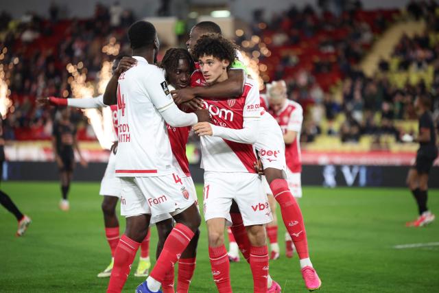 Monaco's French midfielder #11 Maghnes Akliouche (R) celebrates with teammates after scoring his team's second goal during the French L1 football match between AS Monaco and Stade Rennais FC at the Louis II Stadium (Stade Louis II) in the Principality of Monaco on January 31, 2026. (Photo by Valery HACHE / AFP)