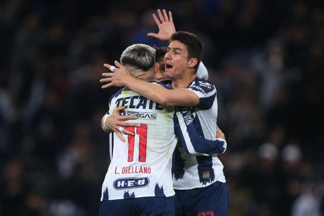Monterrey's Argentine forward #11 Luca Orellano celebrates with teammate Colombian defender #33 Stefan Medina after scoring his team's second goal during the Liga MX Clausura tournament football match between Monterrey and Tijuana at BBVA Stadium in Monterrey, Mexico, on January 31, 2026. (Photo by Julio Cesar AGUILAR / AFP)