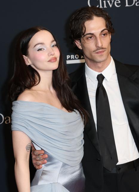 US singer Dove Cameron and Italian singer and songwriter Damiano David attend the Recording Academy and Clive Davis' Salute To Industry Icons pre-Grammy gala at the Beverly Hilton hotel in Beverly Hills, California on January 31, 2026. (Photo by Patrick T. Fallon / AFP)