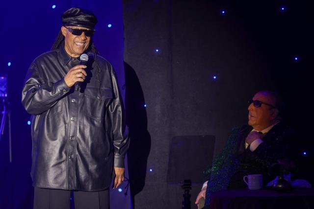 US singer-songwriter Stevie Wonder (L) speaks as legendary US record producer Clive Davis listens during the Recording Academy and Clive Davis' Salute To Industry Icons pre-Grammy gala at the Beverly Hilton hotel in Beverly Hills, California on January 31, 2026. (Photo by Patrick T. Fallon / AFP)