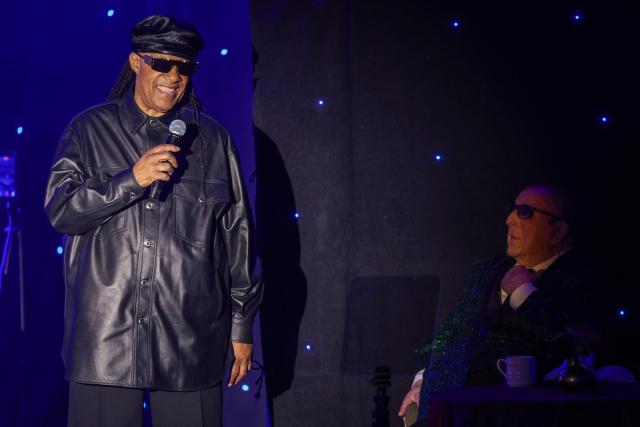 US singer-songwriter Stevie Wonder (L) speaks as legendary US record producer Clive Davis listens during the Recording Academy and Clive Davis' Salute To Industry Icons pre-Grammy gala at the Beverly Hilton hotel in Beverly Hills, California on January 31, 2026. (Photo by Patrick T. Fallon / AFP)