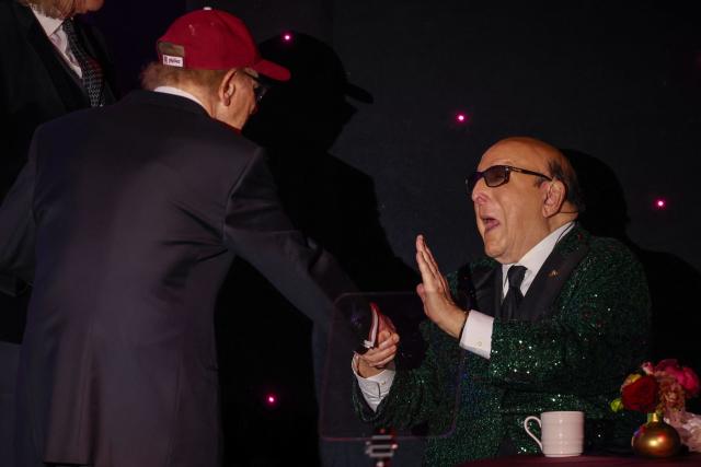 US singer Art Garfunkel greets legendary record producer Clive Davis during the Recording Academy and Clive Davis' Salute To Industry Icons pre-Grammy gala at the Beverly Hilton hotel in Beverly Hills, California on January 31, 2026. (Photo by Patrick T. Fallon / AFP)