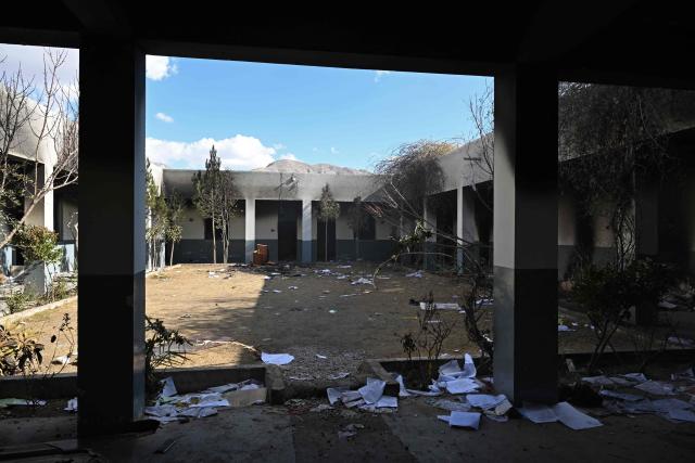 A general view of a torched police station on the outskirts of Quetta on February 1, 2026 a day after an attack by Baloch separatists. Pakistan forces were hunting on February 1 for the separatists behind a string of coordinated attacks in the restive Balochistan province, with the government vowing to retaliate after more than 190 people were killed in two days. (Photo by Banaras KHAN / AFP)