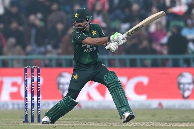 Pakistan's Babar Azam watches the ball after playing a shot during the third Twenty20 international cricket match between Pakistan and Australia at the Gaddafi Stadium in Lahore on February 1, 2026. (Photo by Arif ALI / AFP)