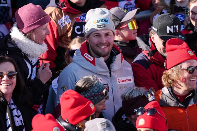 Switzerland's Alexis Monney reacts in the finishing aera after  competing in the men's downhill race part of the FIS Alpine Ski World Cup 2025-2026, in Crans Montana, Switzerland, on February 1, 2026. (Photo by Maxime Schmid / AFP)