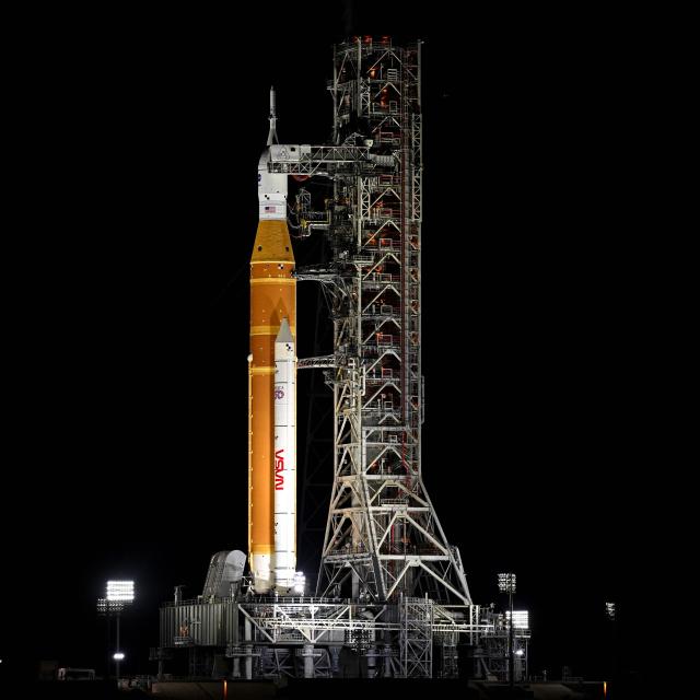 The Space Launch System (SLS) rocket and the Orion spacecraft, integrated for the Artemis II mission, are seen at Launch Pad 39B at the Kennedy Space Center in Cape Canaveral, Florida, on February 1, 2026 ahead of the first crewed mission to the Moon in more than 50 years. (Photo by Miguel J. Rodriguez Carrillo / AFP)