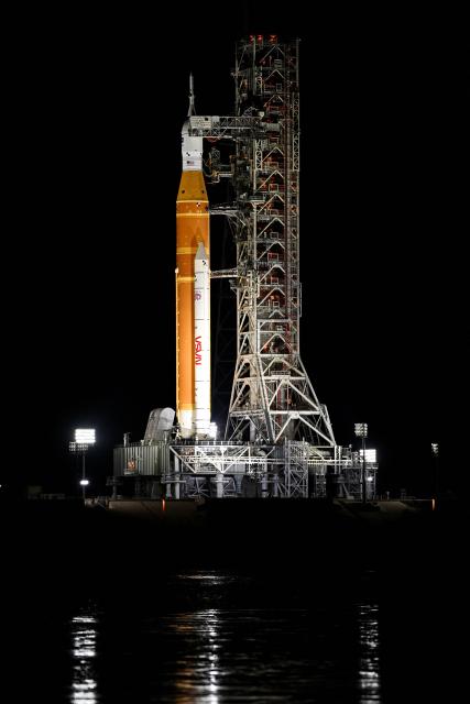 The Space Launch System (SLS) rocket and the Orion spacecraft, integrated for the Artemis II mission, are seen at Launch Pad 39B at the Kennedy Space Center in Cape Canaveral, Florida, on February 1, 2026 ahead of the first crewed mission to the Moon in more than 50 years. (Photo by Miguel J. Rodriguez Carrillo / AFP)