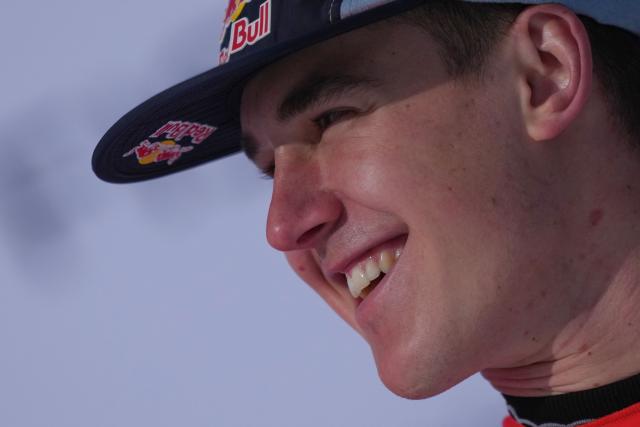 First-placed Switzerland's Franjo Von Allmen celebrates on the podium after competing in the men's downhill race part of the FIS Alpine Ski World Cup 2025-2026, in Crans Montana, Switzerland, on February 1, 2026. (Photo by Maxime Schmid / AFP)