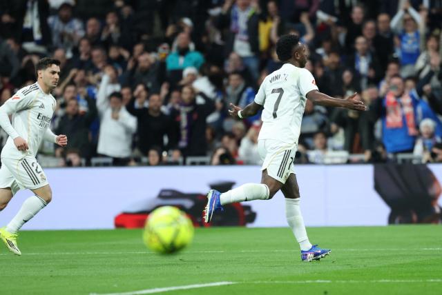 Real Madrid's Brazilian forward #07 Vinicius Junior celebrates scoring the opening goal during the Spanish league football match between Real Madrid CF and Rayo Vallecano at the Santiago Bernabeu stadium in Madrid on February 1, 2026. (Photo by Thomas COEX / AFP)