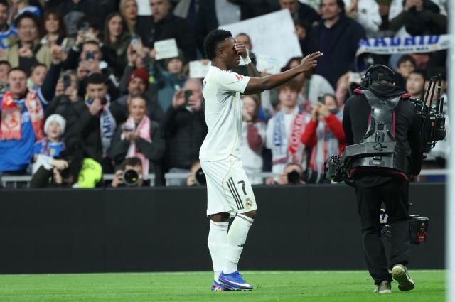 Real Madrid's Brazilian forward #07 Vinicius Junior celebrates scoring the opening goal during the Spanish league football match between Real Madrid CF and Rayo Vallecano at the Santiago Bernabeu stadium in Madrid on February 1, 2026. (Photo by Thomas COEX / AFP)