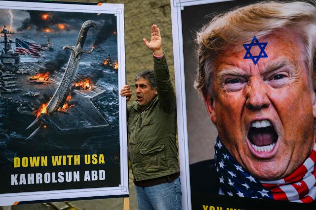 A protester shout slogans next to a picture showing US President Donald Trump during an anti USA demonstration in front of the US consulate in Istanbul, on Febuary 1, 2026. (Photo by Yasin AKGUL / AFP)