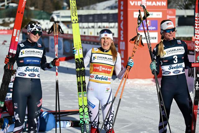 Norway's Ida Marie Hagen (C) celebrates with second placed USA's Alexa Brabec (L) and third placed USA's Tara Geraghty-Moats after the Women's Individual Gundersen Normal Hill HS109/7,5km event of the FIS Nordic Combined World Cup in Seefeld, Austria, on February 1, 2026. (Photo by BARBARA GINDL / APA / AFP) / Austria OUT