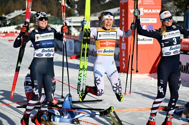 Norway's Ida Marie Hagen (C) celebrates with second placed USA's Alexa Brabec (L) and third placed USA's Tara Geraghty-Moats after the Women's Individual Gundersen Normal Hill HS109/7,5km event of the FIS Nordic Combined World Cup in Seefeld, Austria, on February 1, 2026. (Photo by BARBARA GINDL / APA / AFP) / Austria OUT