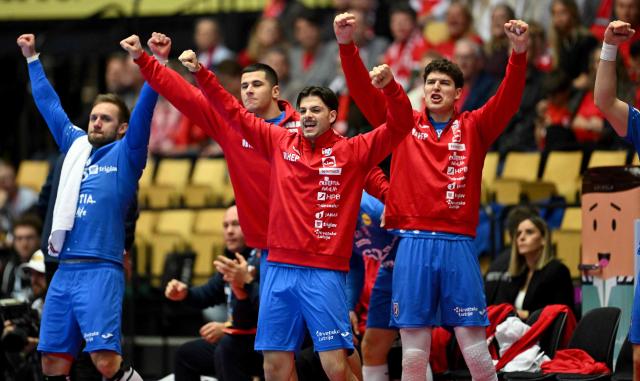 Players on Croatia's bench celebrate during the men's EHF Euro 2026 third place handball match Iceland vs Croatia in Herning, Denmark, on February 1, 2026. (Photo by Jonathan Nackstrand / AFP)