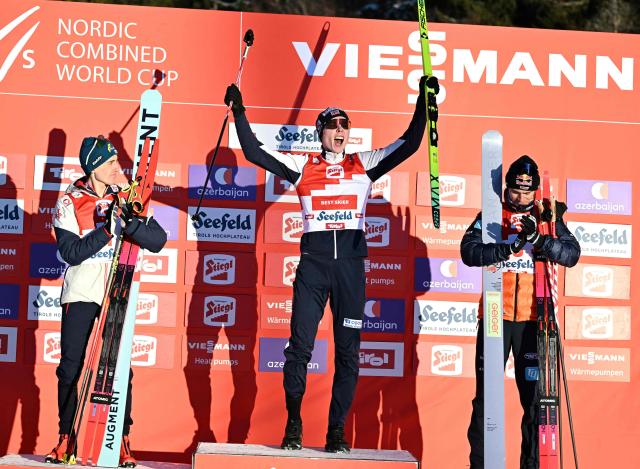 (L-R) Second placed Austria's Stefan Rettenegger, winner Norway's Jens Luraas Oftebro and third placed Germany's Vinzenz Geiger pose on the podium after the Men's Individual Gundersen Norman Hill HS109/12,5km event of the FIS Nordic Combined World Cup in Seefeld, Austria, on February 1, 2026. (Photo by BARBARA GINDL / APA / AFP) / Austria OUT