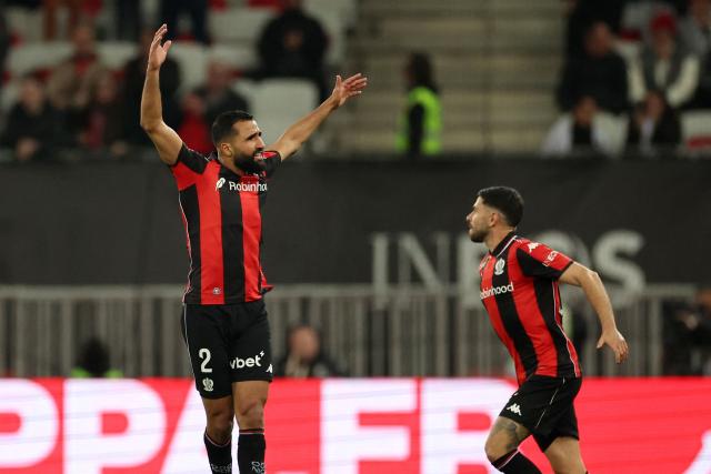 Nice's Tunisian defender #02 Ali Abdi (L) celebrates after scoring a goal during the French L1 football match between OGC Nice and Stade Brestois 29 (Brest) at the Allianz Riviera Stadium in Nice, south-eastern France, on February 1, 2026.  (Photo by Valery HACHE / AFP)