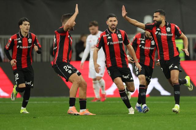 Nice's Tunisian defender #02 Ali Abdi (R) celebrates after scoring a goal during the French L1 football match between OGC Nice and Stade Brestois 29 (Brest) at the Allianz Riviera Stadium in Nice, south-eastern France, on February 1, 2026.  (Photo by Valery HACHE / AFP)