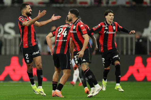 Nice's Tunisian defender #02 Ali Abdi (L) celebrates after scoring a goal during the French L1 football match between OGC Nice and Stade Brestois 29 (Brest) at the Allianz Riviera Stadium in Nice, south-eastern France, on February 1, 2026.  (Photo by Valery HACHE / AFP)