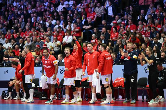 Denmark's players celebrate during the Men's EHF Euro 2026 final handball match Denmark vs Germany in Herning, Denmark, on February 1, 2026. (Photo by Jonathan Nackstrand / AFP)