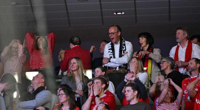 German Chancellor Friedrich Merz (back row 3R), his wife Charlotte Merz  (3R), Danish Prime Minister Mette Frederiksen (3L) and Queen Mary of Denmark (2L) react as they watch from the stands the Men's EHF Euro 2026 final handball match Denmark vs Germany in Herning, Denmark, on February 1, 2026. (Photo by Jonathan Nackstrand / AFP)