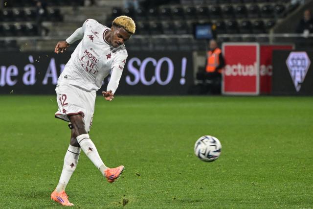 Metz's Senegalese midfielder #012 Alpha Toure kicks the ball during the French L1 football match between SCO Angers and FC Metz at the Stade Raymond-Kopa in Angers on February 1, 2026. (Photo by Damien Meyer / AFP)