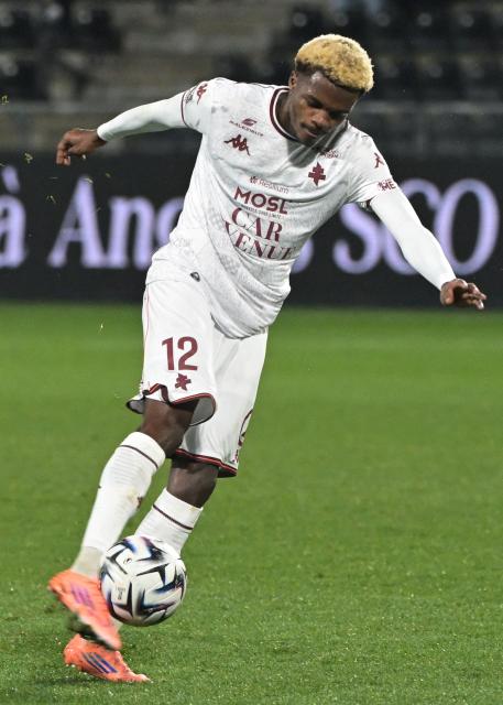 Metz's Senegalese midfielder #012 Alpha Toure kicks the ball during the French L1 football match between SCO Angers and FC Metz at the Stade Raymond-Kopa in Angers on February 1, 2026. (Photo by Damien Meyer / AFP)