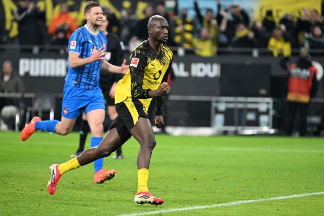 Dortmund's Guinean forward #09 Serhou Guirassy celebrates after scoring a goal during the German first division Bundesliga football match between Borussia Dortmund and Heidenheim in Dortmund, western Germany, on February 1, 2026. (Photo by UWE KRAFT / AFP) / DFL REGULATIONS PROHIBIT ANY USE OF PHOTOGRAPHS AS IMAGE SEQUENCES AND/OR QUASI-VIDEO