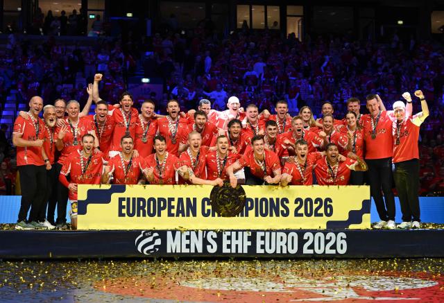 Denmark's team celebrates after winning the Men's EHF Euro 2026 final handball match Denmark vs Germany in Herning, Denmark, on February 1, 2026. (Photo by Jonathan Nackstrand / AFP)