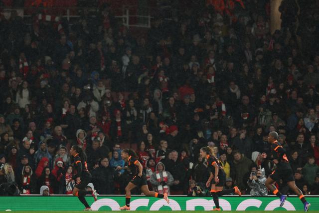 Corinthians' Brazilian midfielder #17 Vic Albuqueque (L) celebrates with teammates after scoring their second goal from the penalty spot during the FIFA Women's Champions Cup final football match between Arsenal and Corinthians at the Emirates Stadium in London on February 1, 2026. (Photo by Adrian Dennis / AFP)