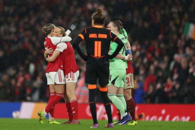 Arsenal players celebrate at the end of extra time in the FIFA Women's Champions Cup final football match between Arsenal and Corinthians at the Emirates Stadium in London on February 1, 2026. Arsenal won the game 3-2 after extra time. (Photo by Adrian Dennis / AFP)