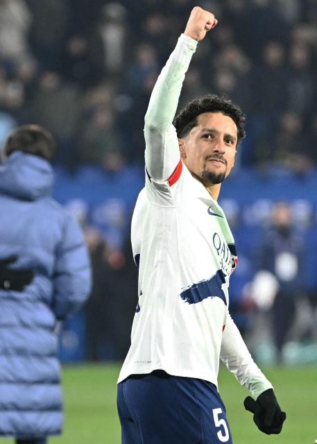 Paris Saint-Germain's Brazilian defender #05 Marquinhos celebrates winning the French L1 football match between RC Strasbourg Alsace and Paris Saint-Germain (PSG) at the Stade de la Meinau in Strasbourg, eastern France, on February 1, 2026. (Photo by SEBASTIEN BOZON / AFP)