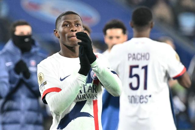 Paris Saint-Germain's Portuguese defender #25 Nuno Mendes celebrates winning the French L1 football match between RC Strasbourg Alsace and Paris Saint-Germain (PSG) at the Stade de la Meinau in Strasbourg, eastern France, on February 1, 2026. (Photo by SEBASTIEN BOZON / AFP)