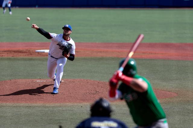 Puerto Rico’s Collin Wiles #45 pitches during the first game of the Caribbean Series baseball tournament between Mexico's Tomateros de Culiacan and Puerto Rico's Cangrejeros de Santurce at the Panamerican Stadium in Jalisco, Mexico on February 1, 2026. (Photo by Ulises Ruiz / AFP)
