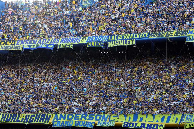 Boca Juniors fans cheer for their team ahead of the Argentine Professional Football League 2026 Apertura Tournament match between Boca Juniors and Newell's Old Boys at La Bombonera stadium in Buenos Aires on February 1, 2026. (Photo by ALEJANDRO PAGNI / AFP)