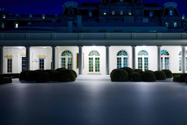 A layer of snow and ice is covers the Rose Garden of the White House in Washington, DC, on February 1, 2026. (Photo by Aaron Schwartz / AFP)