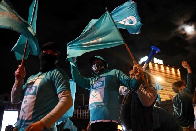 Supporters of Costa Rica’s presidential candidate from the Sovereign People Party, Laura Fernandez, wave flags as they wait for the results of the presidential election outside the Aurola Hotel in San Jose on February 1, 2026. Voters in Costa Rica, a beacon of stability in Central America threatened by a surge in drug-related violence, went to the polls in general elections that are expected to bring a tough-on-crime right-winger to power. (Photo by MARVIN RECINOS / AFP)