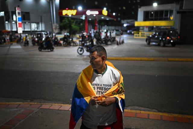 Former political prisoner Guillermo Lopez attends a demonstration demanding the release of detainees outside the El Helicoide building, headquarters of the Bolivarian National Intelligence Service (SEBIN), in Caracas on February 1, 2026. (Photo by Federico PARRA / AFP)